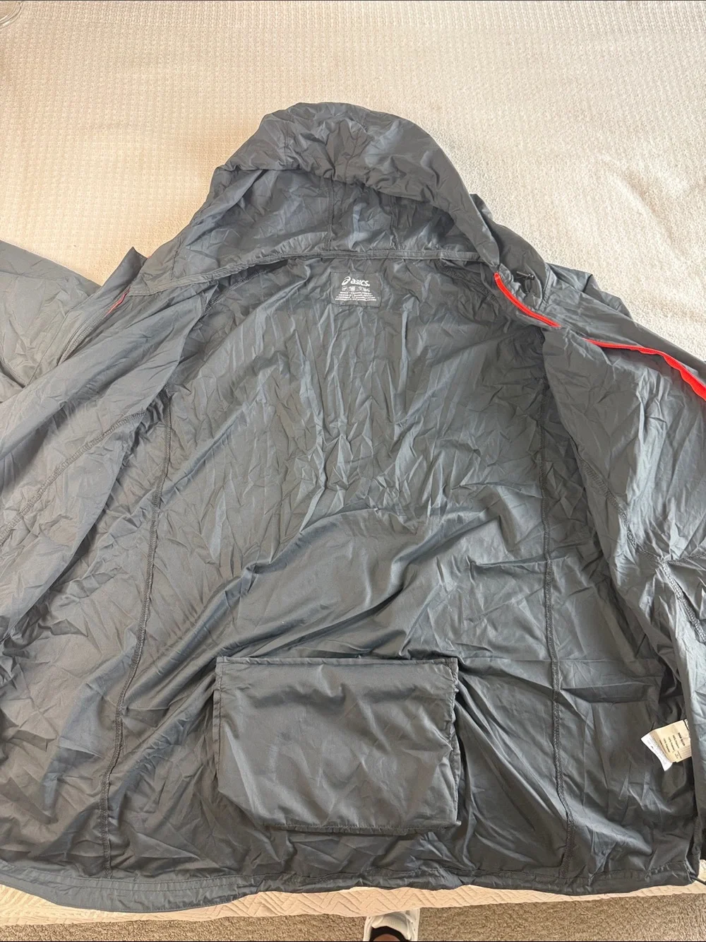 Asics packable jacket folds into pocket dark gray size XXL orange accents